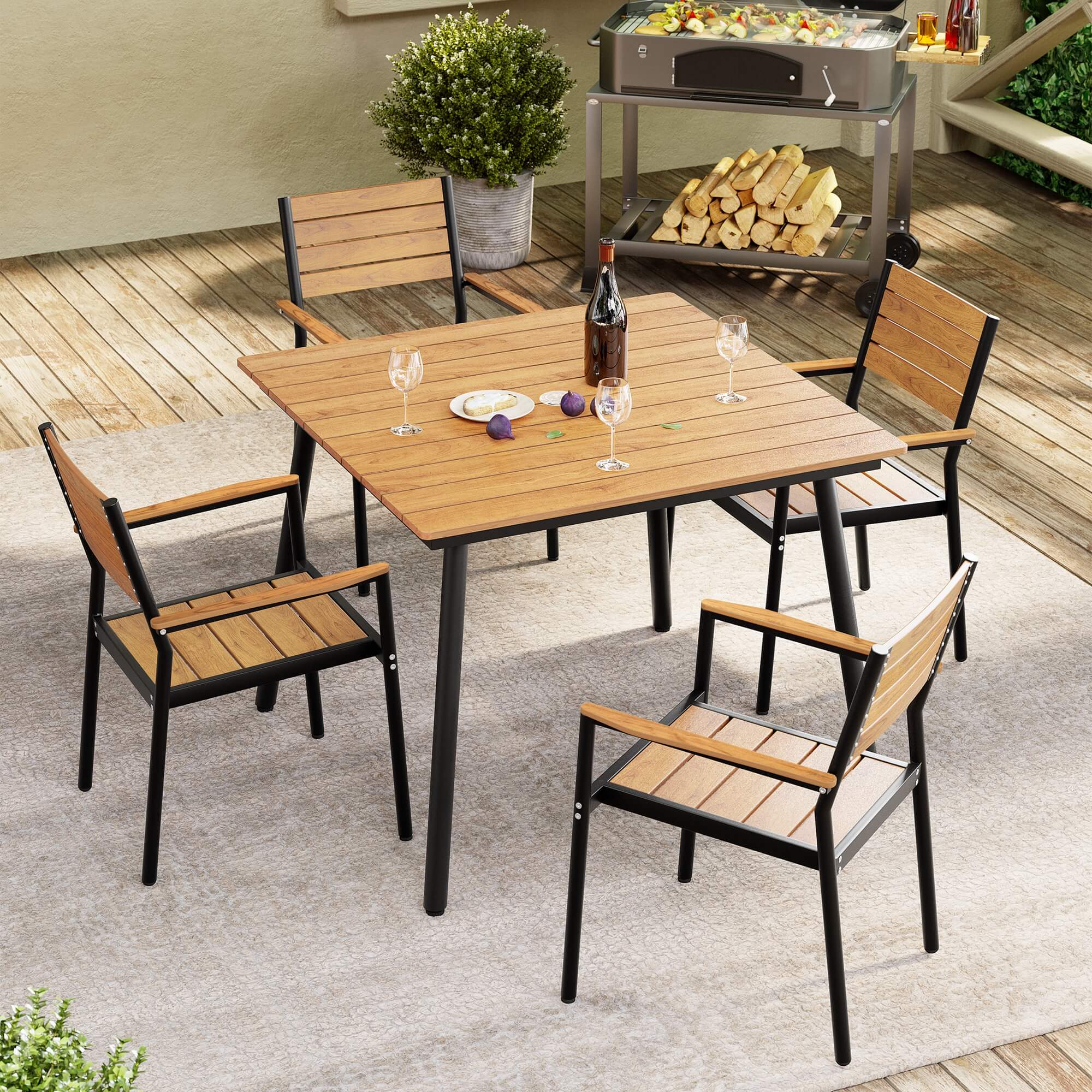 Lifestyle shot of teak-finish aluminum stackable outdoor dining chair set with table on patio deck.