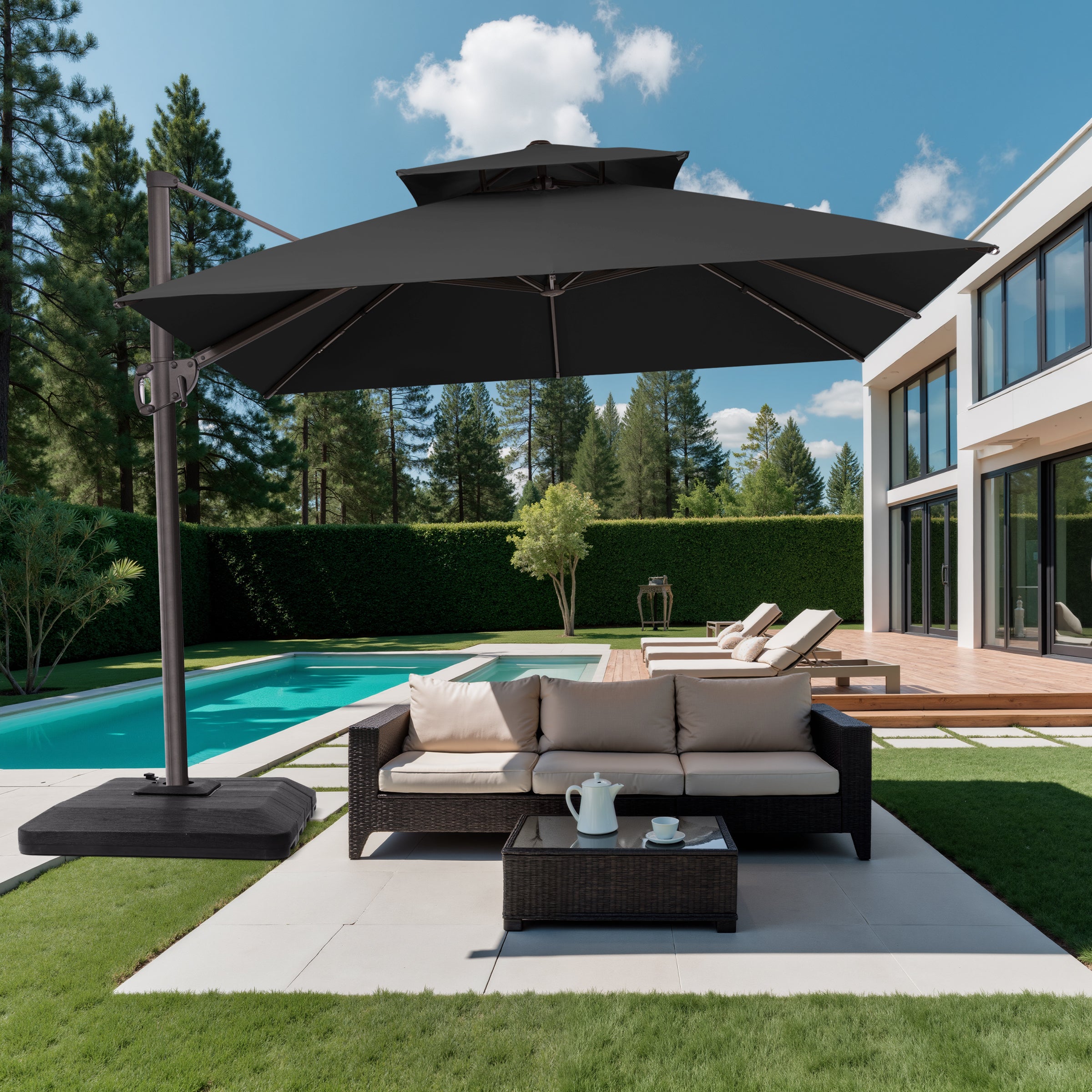 10x10 ft square black cantilever umbrella with low-profile base shading a patio sofa set at a modern villa poolside