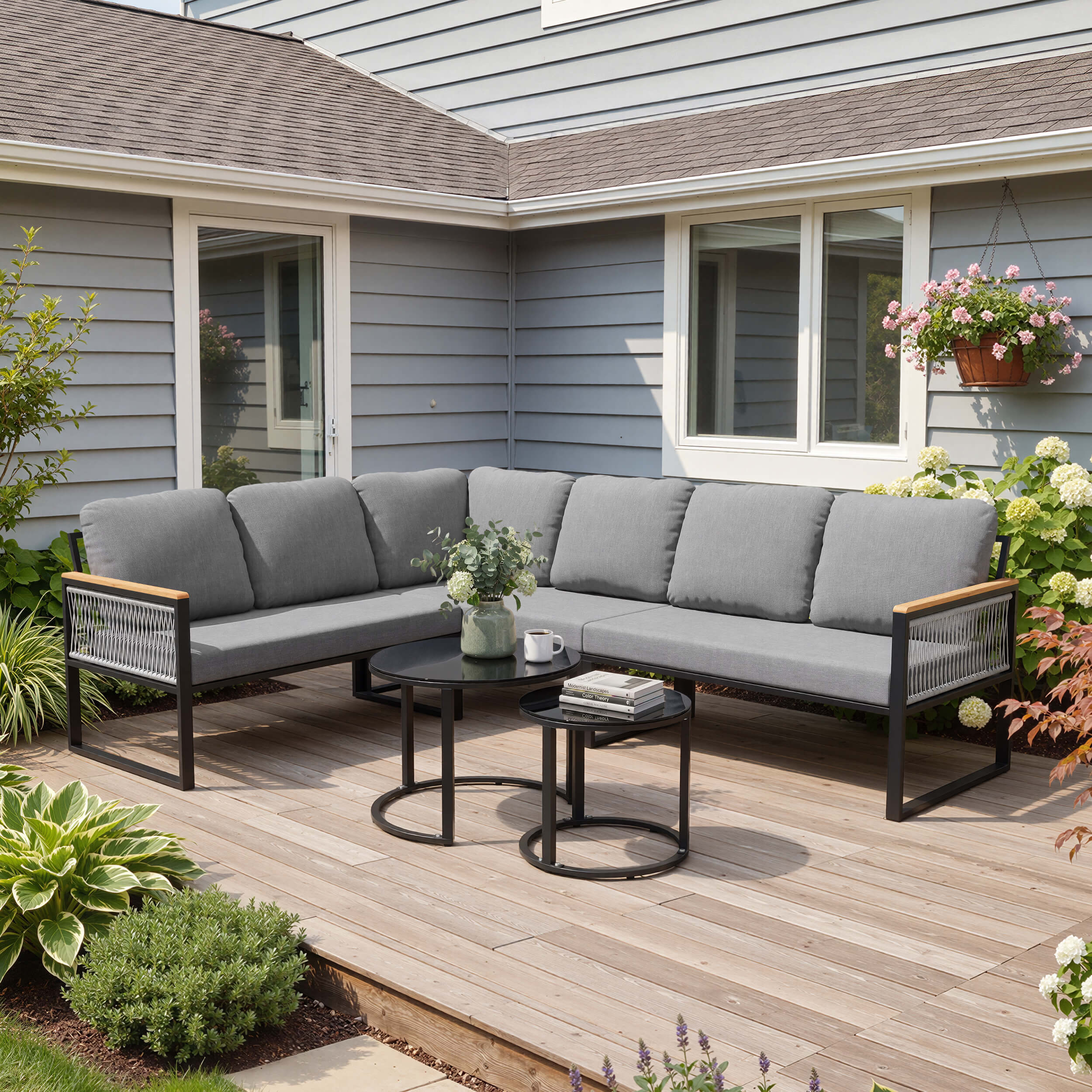 Modular PE wicker outdoor sectional sofa set with gray cushions on backyard patio deck.