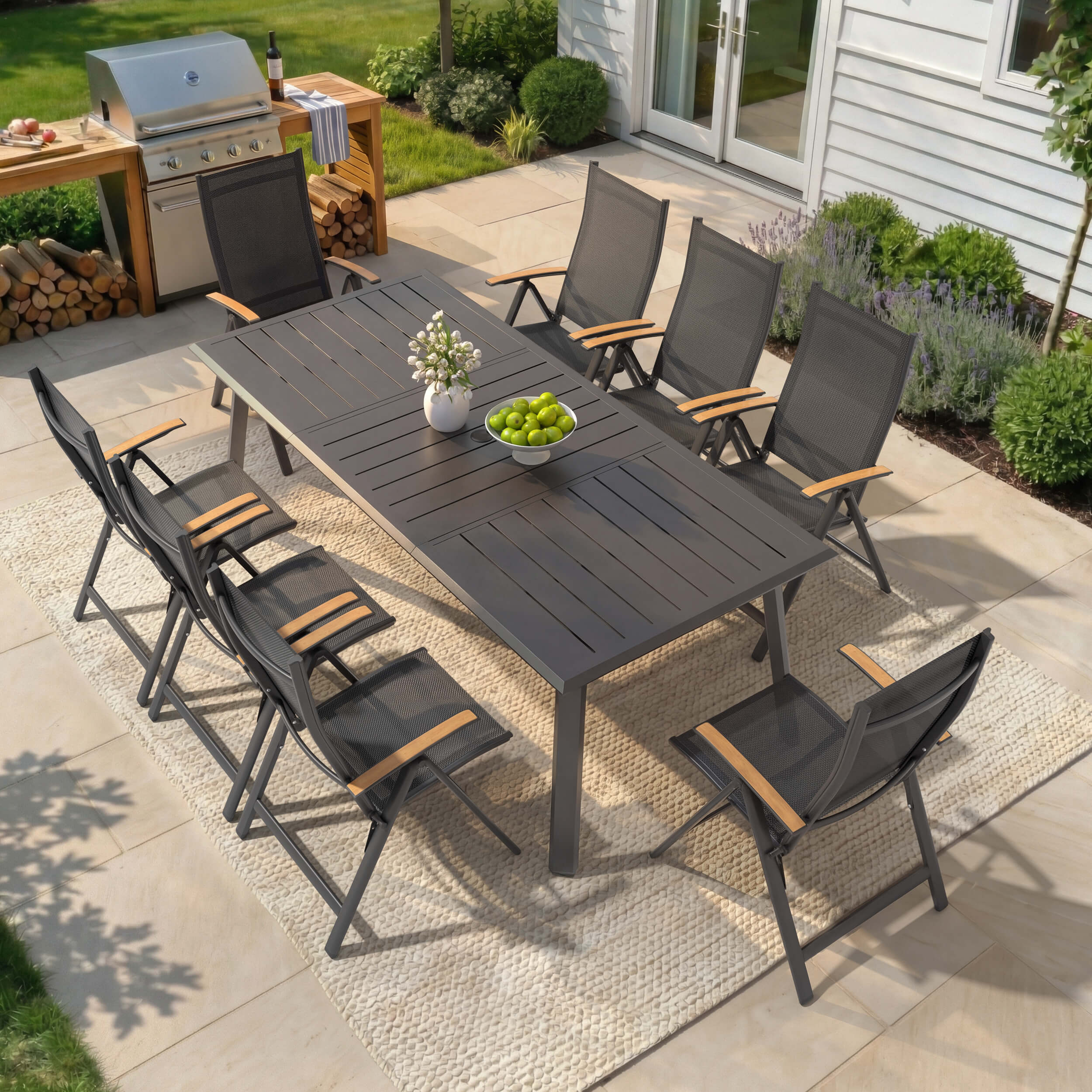 9-piece patio dining set with aluminum expandable table and 8 folding textilene chairs on patio.