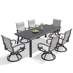 7-piece patio dining set with aluminum expandable table and 6 grey swivel Sunbrella chairs.