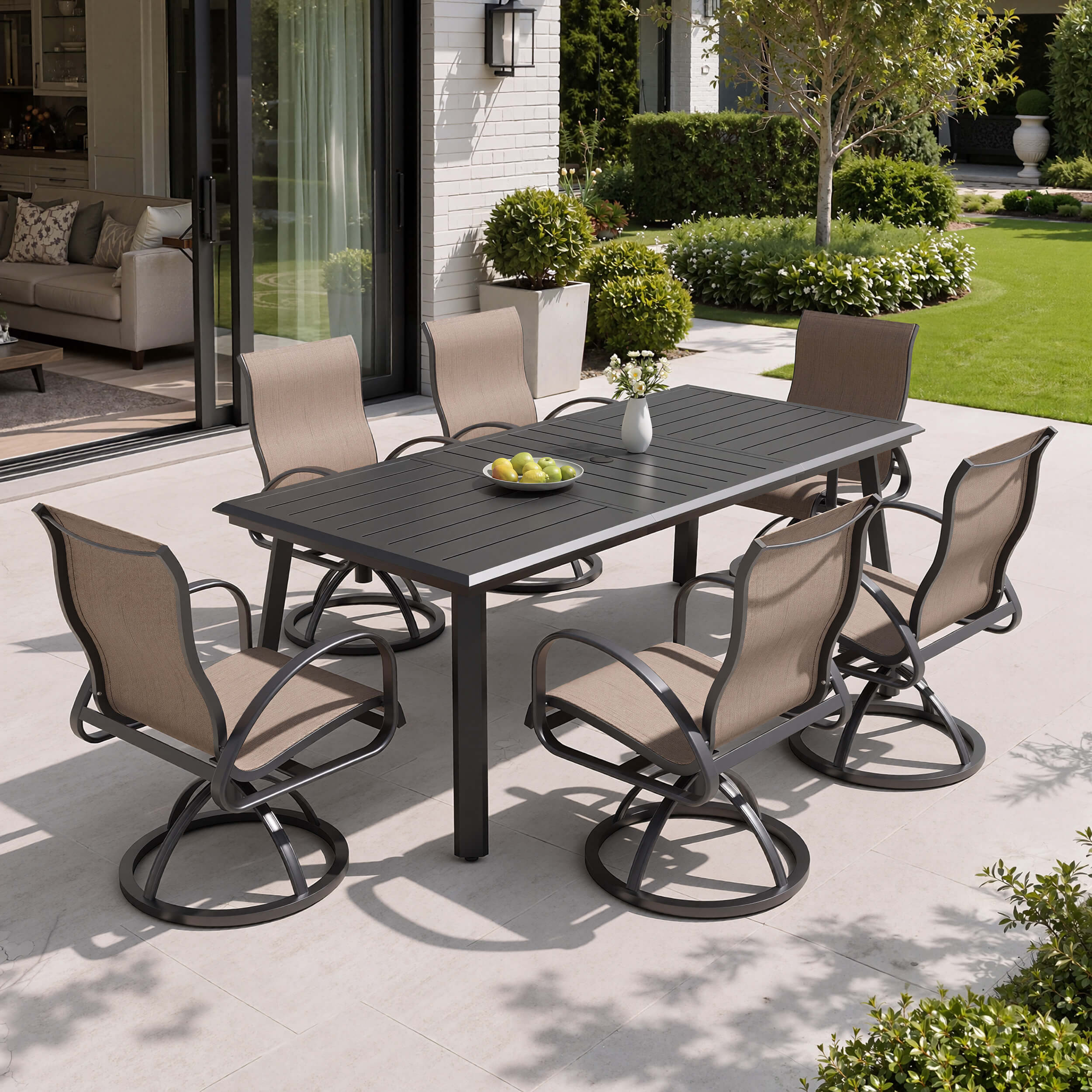 7-piece patio dining set with aluminum expandable table and 6 Sunbrella swivel rockers on patio.