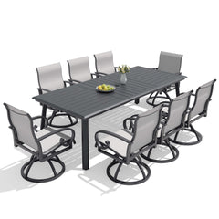 9-piece patio dining set with aluminum expandable table and 8 grey swivel Sunbrella chairs.