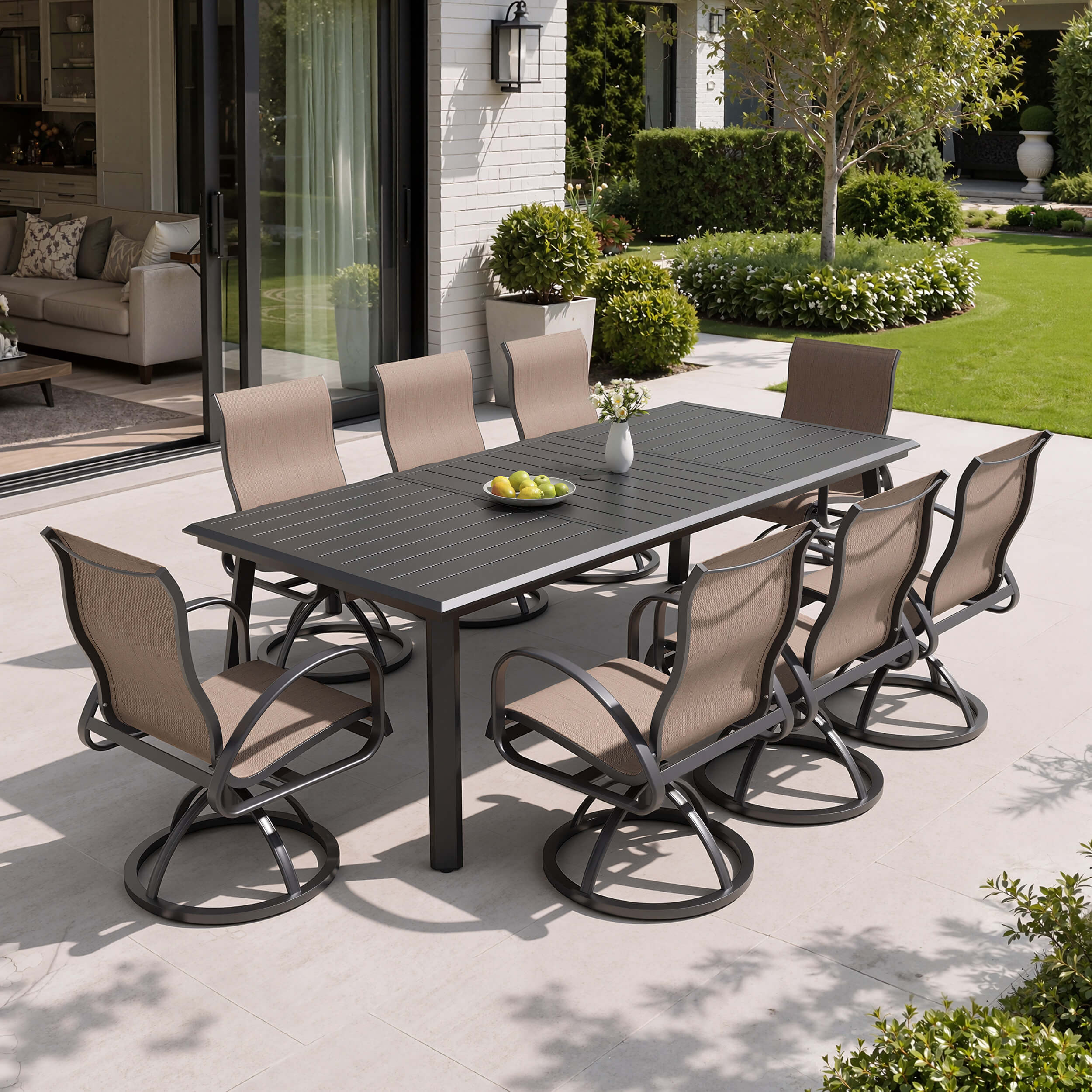 9-piece patio dining set with aluminum expandable table and 8 Sunbrella swivel rockers on patio.