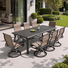 9-piece patio dining set with aluminum expandable table and 8 Sunbrella swivel rockers on patio.