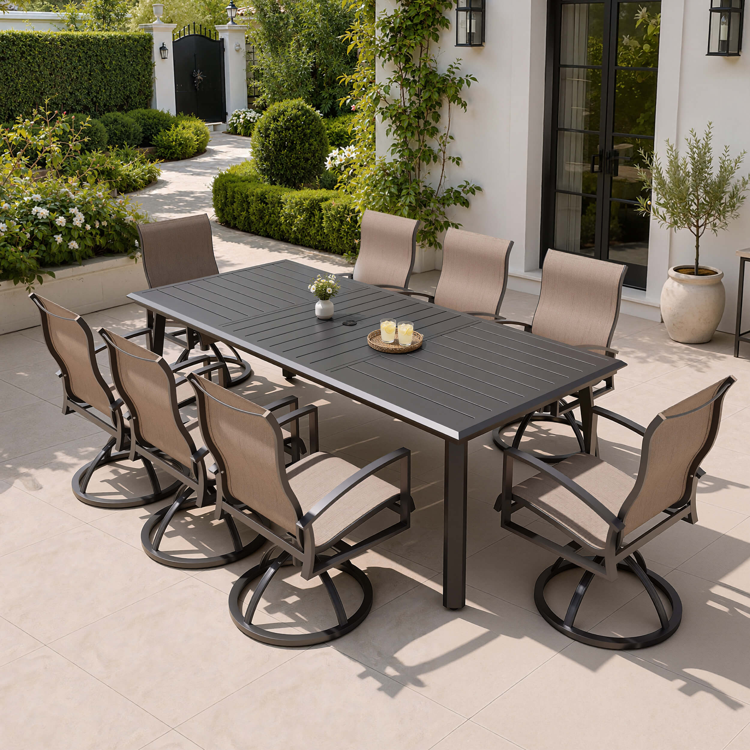 9-piece patio dining set with aluminum expandable table and 8 Sunbrella swivel rockers on patio.