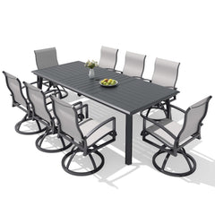 9-piece patio dining set with aluminum expandable table and 8 Sunbrella swivel rockers.