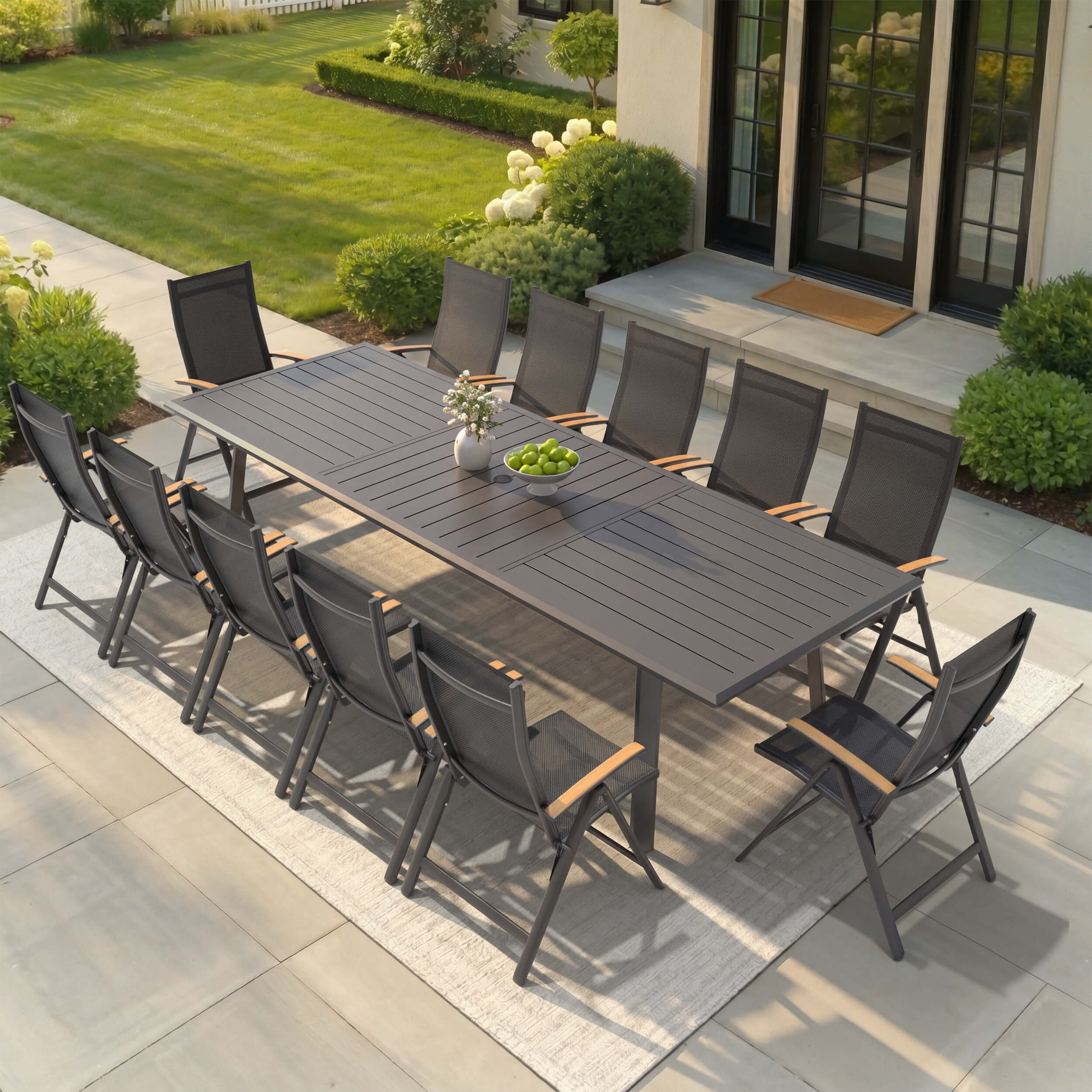 13-piece patio dining set with aluminum expandable table and 12 folding textilene chairs on patio.