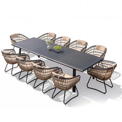 11-piece patio dining set with aluminum expandable table and 10 wicker chairs with cushions.
