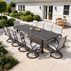 11-piece patio dining set with aluminum expandable table and 10 Sunbrella swivel rockers on patio.