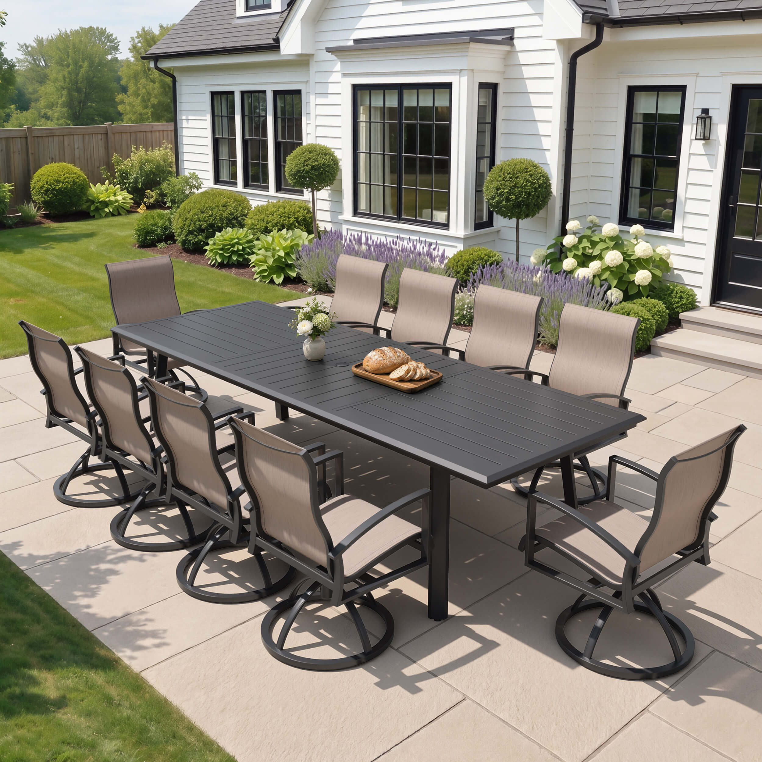 11-piece patio dining set with aluminum expandable table and 10 Sunbrella swivel rockers on patio.