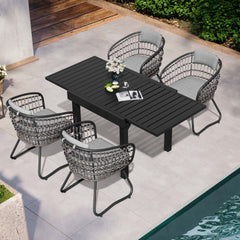 5-piece expandable patio dining set with black aluminum table and 4 grey PE rattan chairs poolside.
