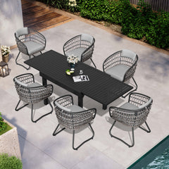 7-piece expandable patio dining set with black aluminum table and 6 grey PE rattan chairs poolside.