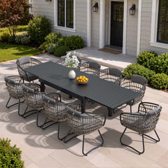 11-piece expandable patio dining set with black aluminum table and 10 grey PE rattan chairs on patio.