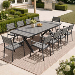 10-person dark grey patio dining set with WPC slatted umbrella table and armchairs in backyard.
