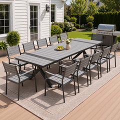 12-person dark grey patio dining set with WPC slatted umbrella table and armchairs on deck.